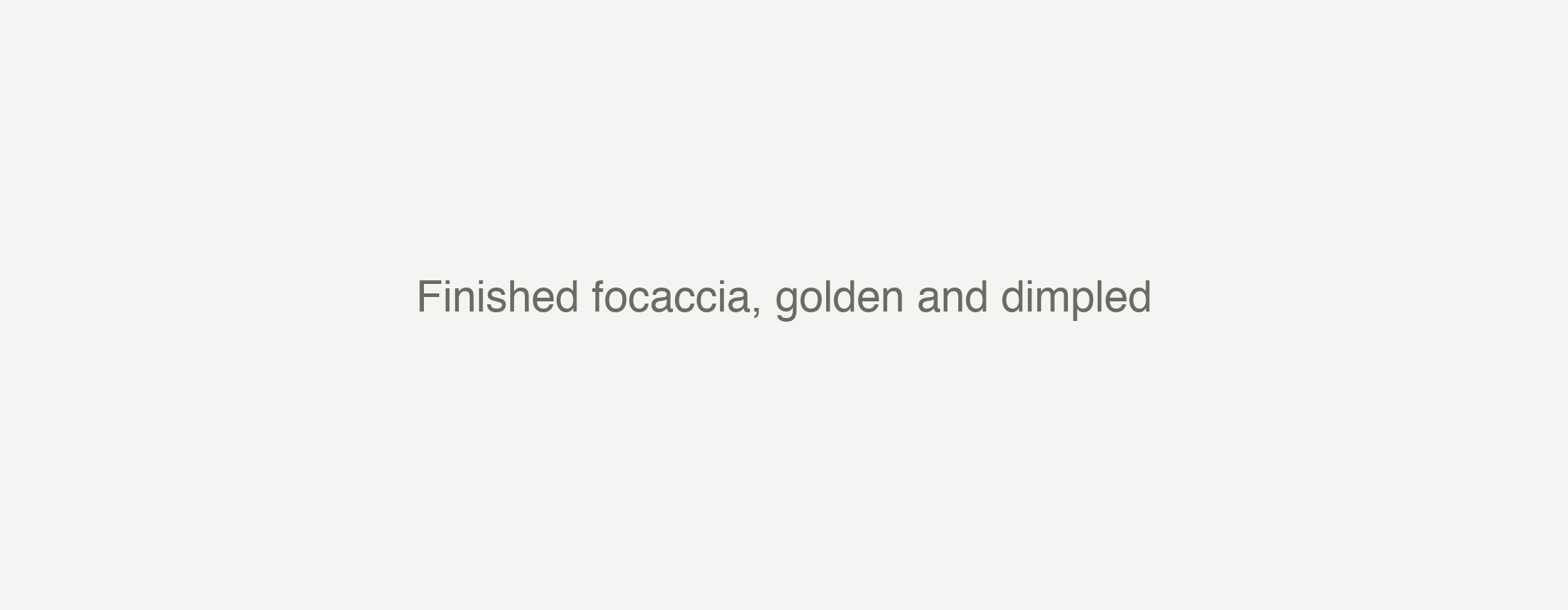 Finished focaccia, golden and dimpled